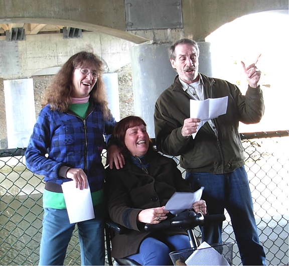 Kim Goldberg, Kim Clark & Darryl Knowles perform REACTOR in Nanaimo's Pearson Bridge underpass on march 11, 2014 to mark the third anniversary of the Fukushima disaster. (Photo by Katy McCuish)